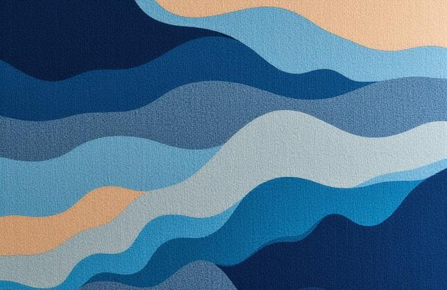 Tappeto di lana e seta annodato a mano con un motivo astratto di onde marine in gradazioni di blu intenso, azzurro e beige sabbia.